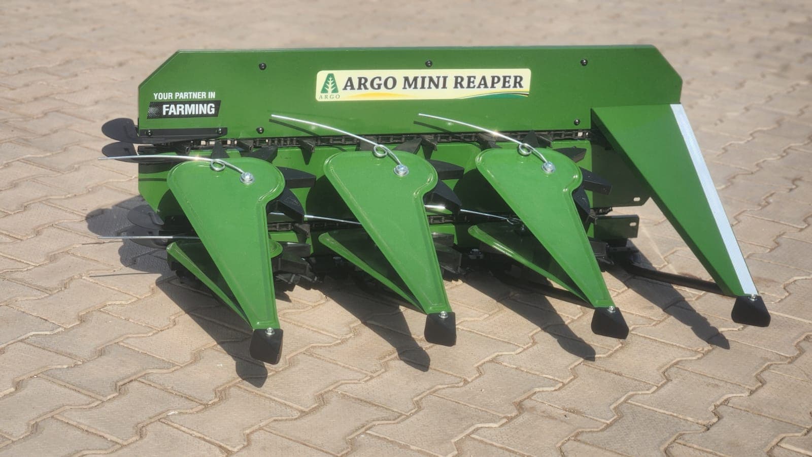 Green reaper header on pavers