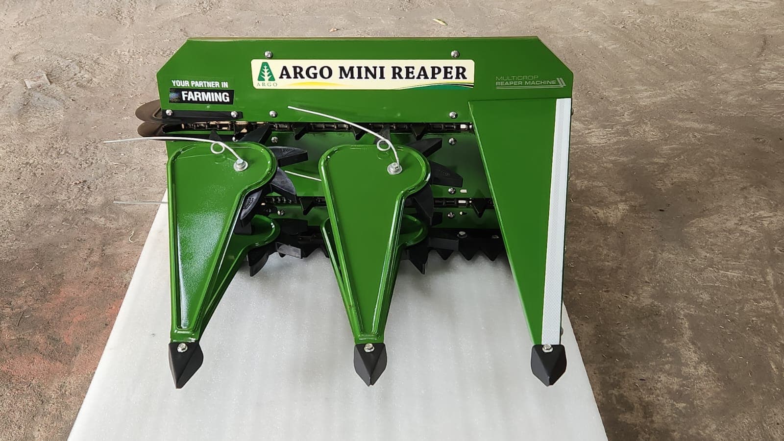 Green reaper header, angled view